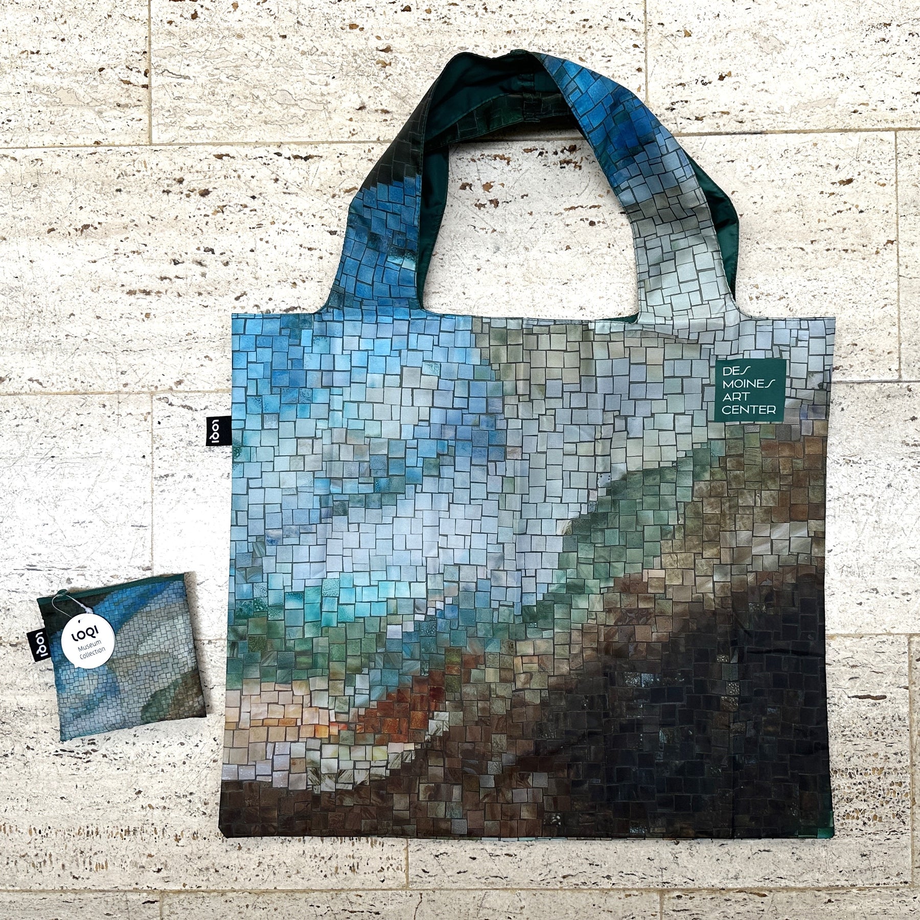 Tote bag with mosaic design on a textured surface